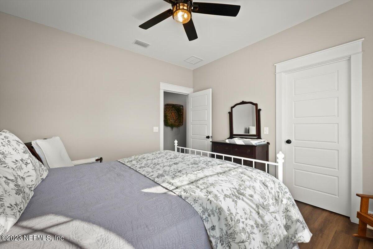 3200 Jane Lane Hilliard, FL 32046 - Photo 35 of 72 a bedroom with a bed and wooden floor