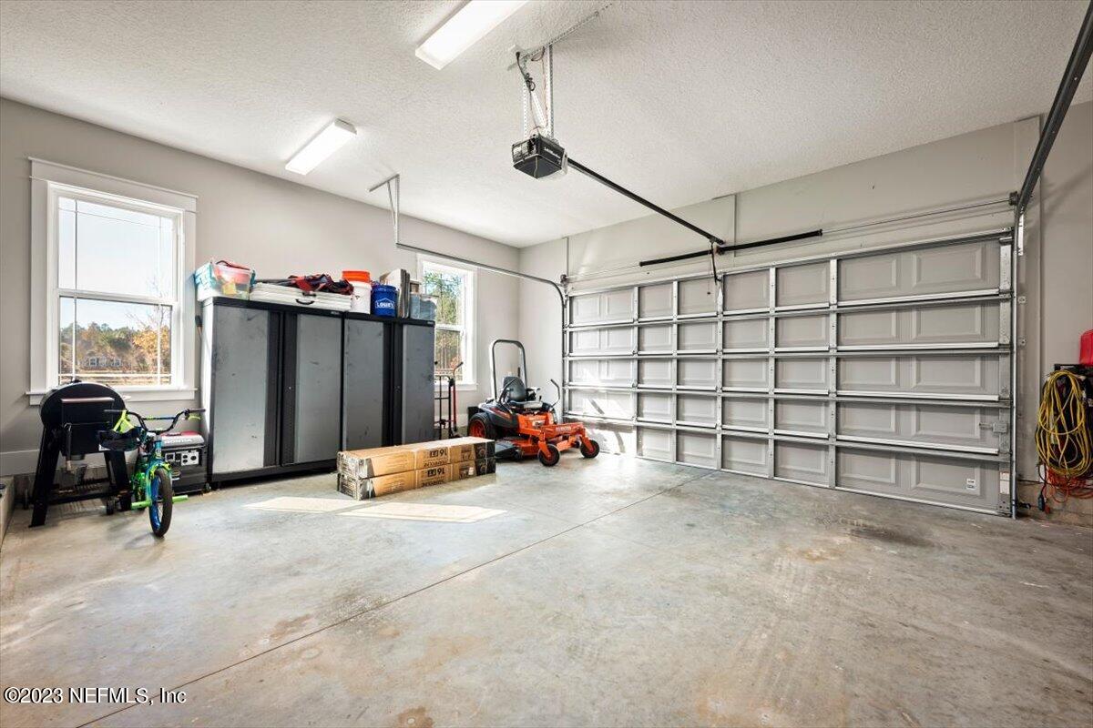 3200 Jane Lane Hilliard, FL 32046 - Photo 37 of 72 a view of a livingroom with furniture and a garage