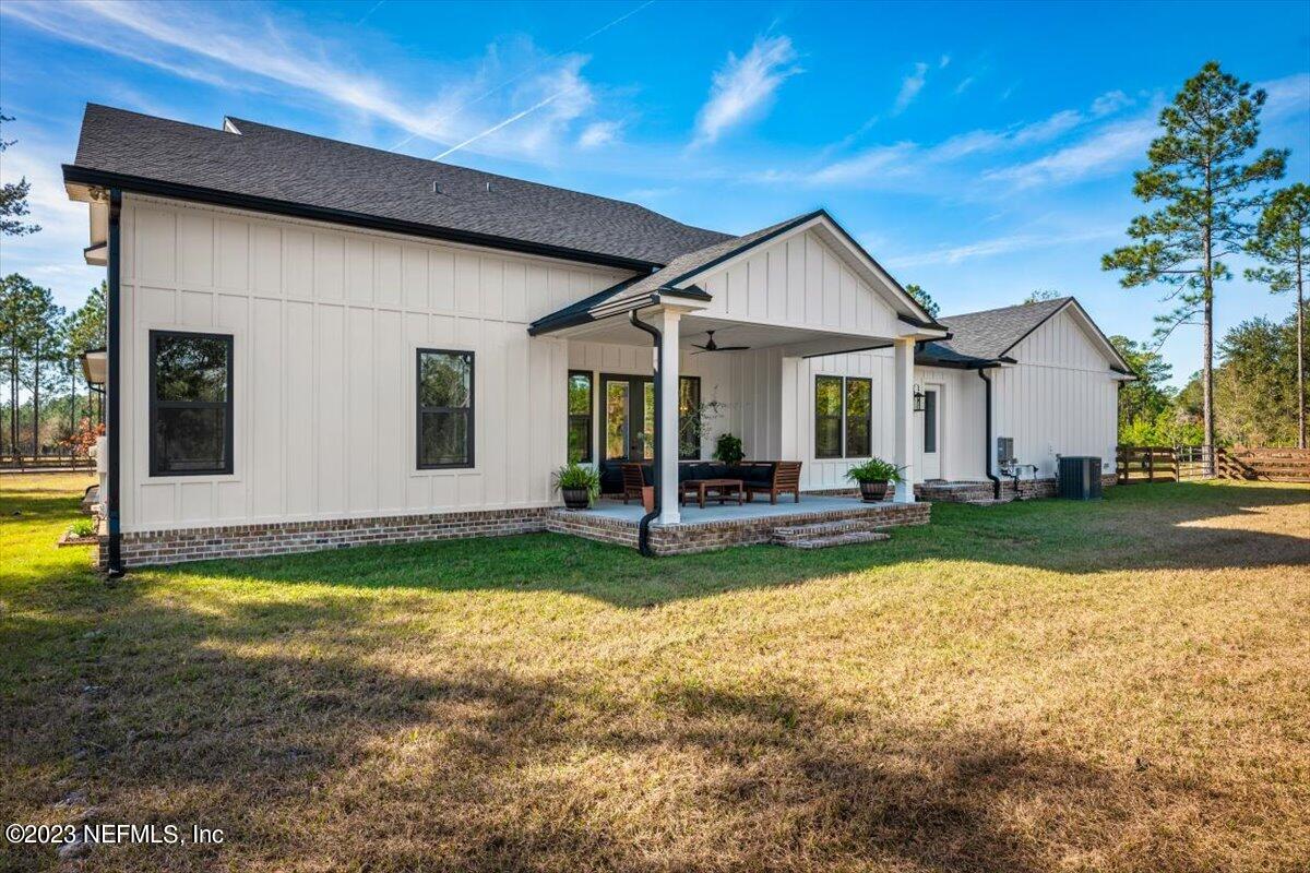 3200 Jane Lane Hilliard, FL 32046 - Photo 42 of 72 a view of a house with backyard porch and sitting area