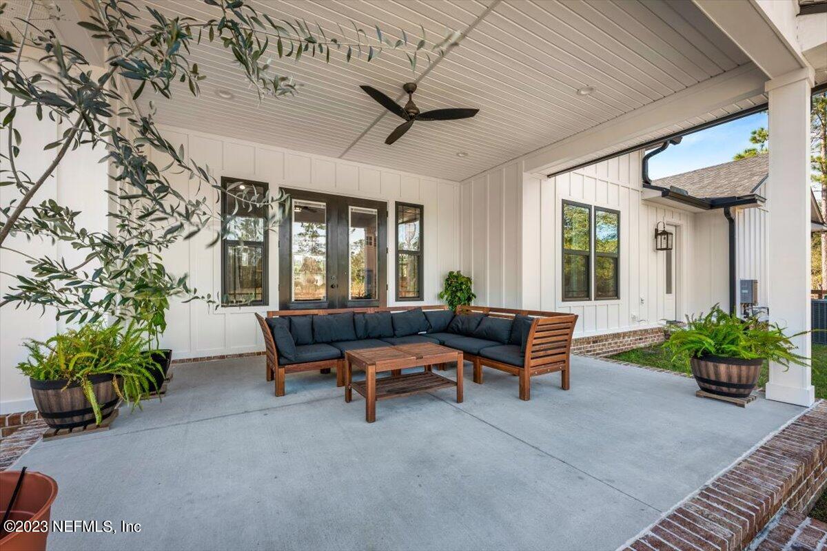 3200 Jane Lane Hilliard, FL 32046 - Photo 43 of 72 a outdoor living space with furniture and a potted plant