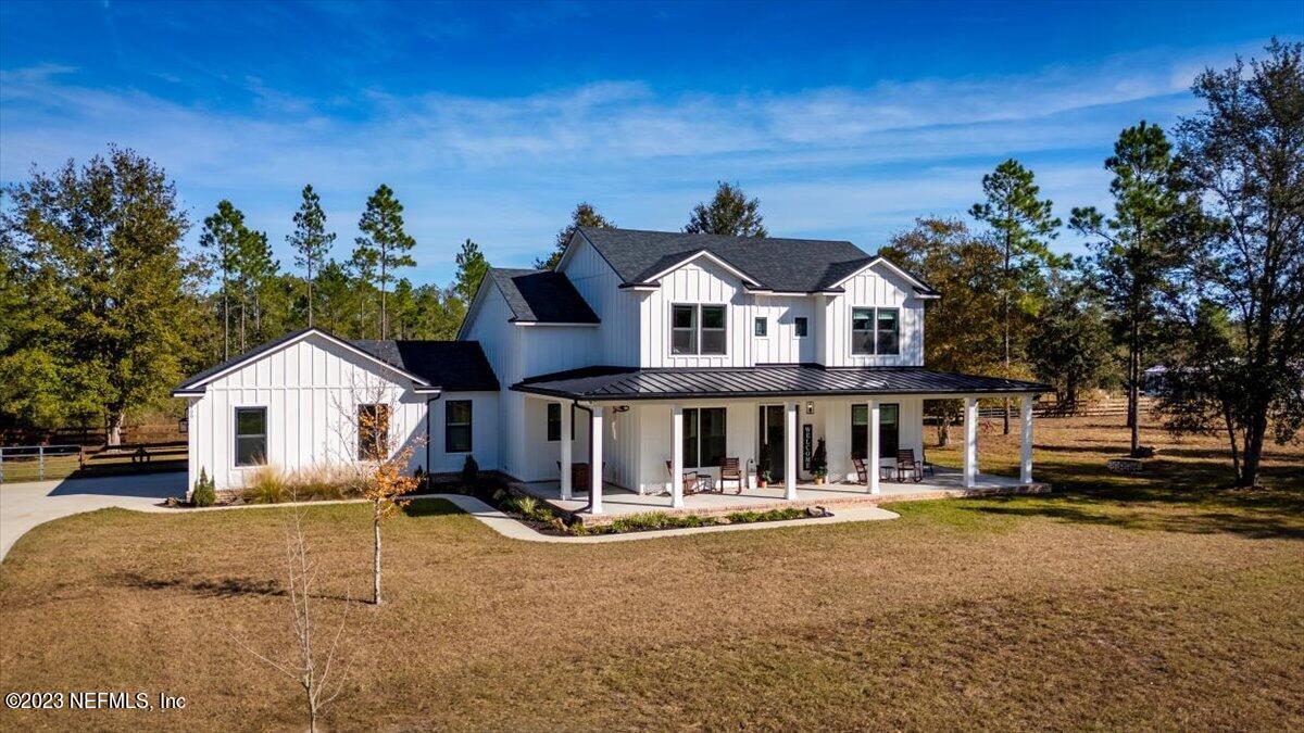 3200 Jane Lane Hilliard, FL 32046 - Photo 46 of 72 a front view of a house with a yard