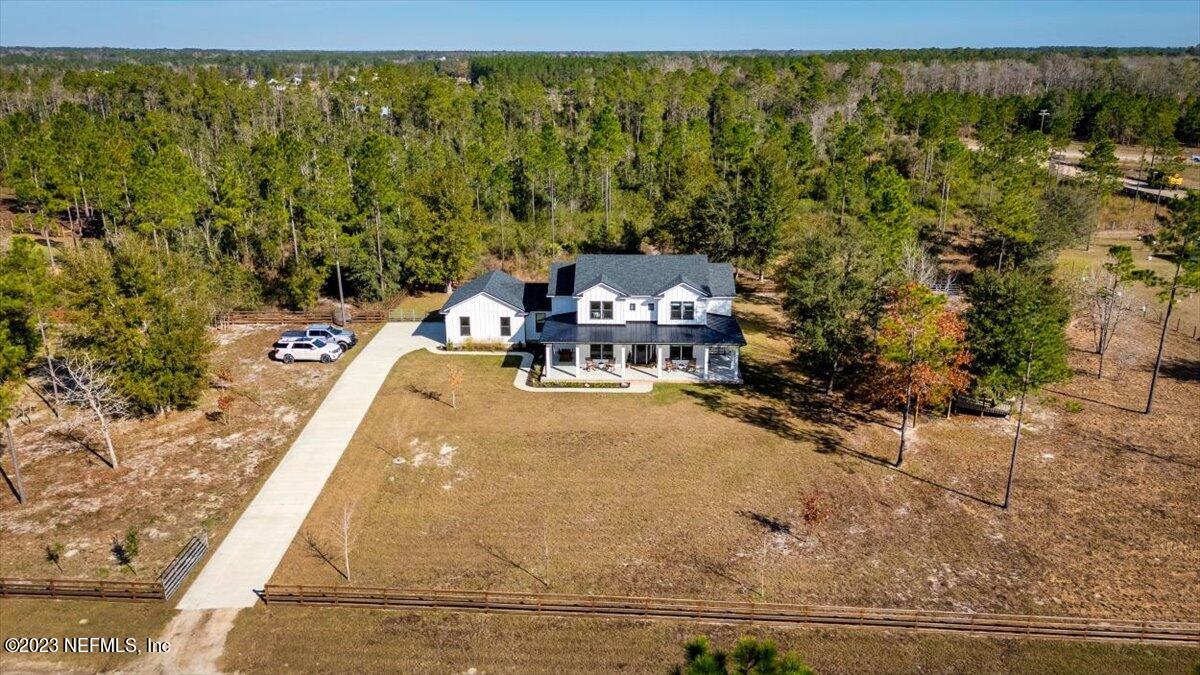 3200 Jane Lane Hilliard, FL 32046 - Photo 49 of 72 a view of a swimming pool with a yard