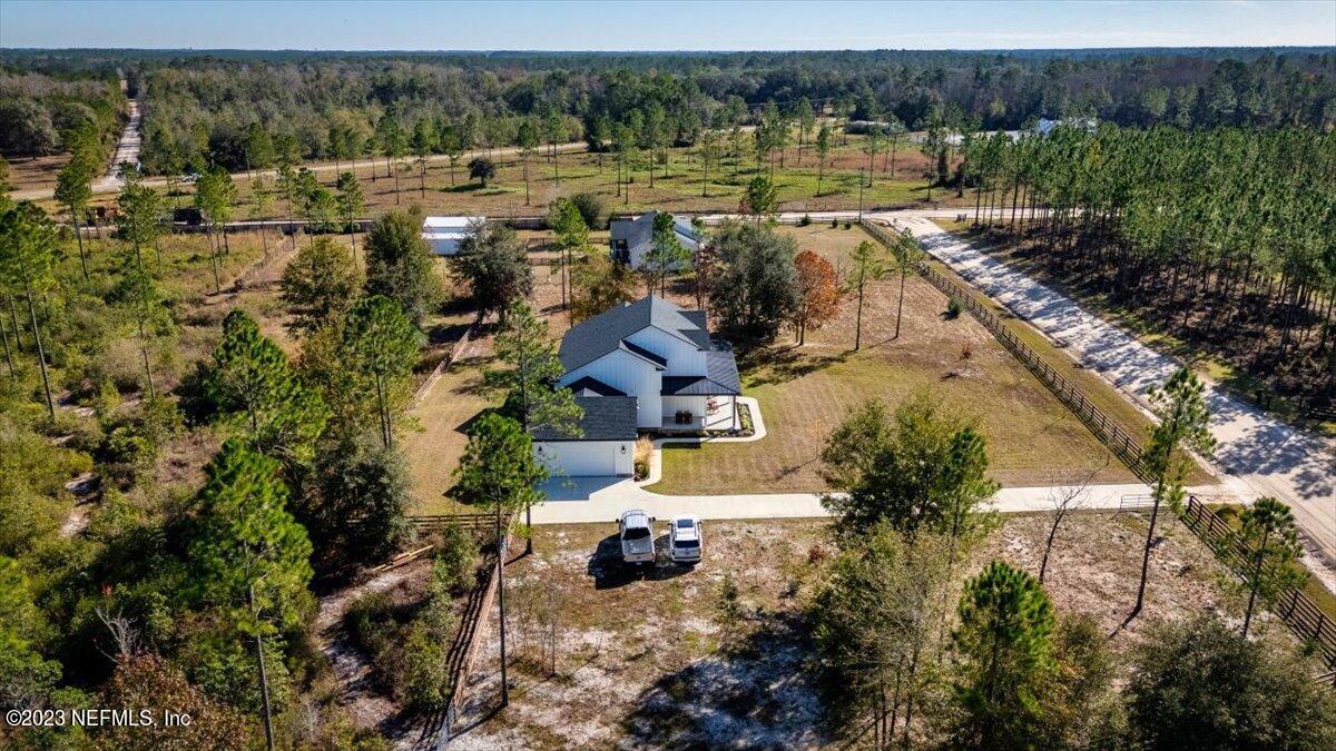 3200 Jane Lane Hilliard, FL 32046 - Photo 60 of 72 an aerial view of a house with a yard and lake view