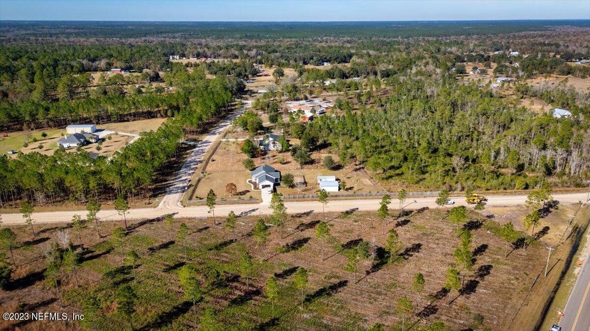 3200 Jane Lane Hilliard, FL 32046 - Photo 65 of 72 an aerial view of a house with a yard