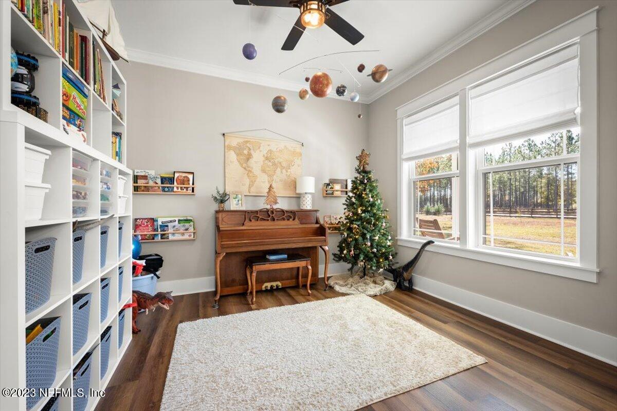 3200 Jane Lane Hilliard, FL 32046 - Photo 6 of 72 a living room with furniture cabinets and a window