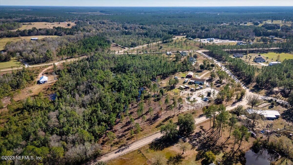 3200 Jane Lane Hilliard, FL 32046 - Photo 70 of 72 an aerial view of residential houses with outdoor space and trees