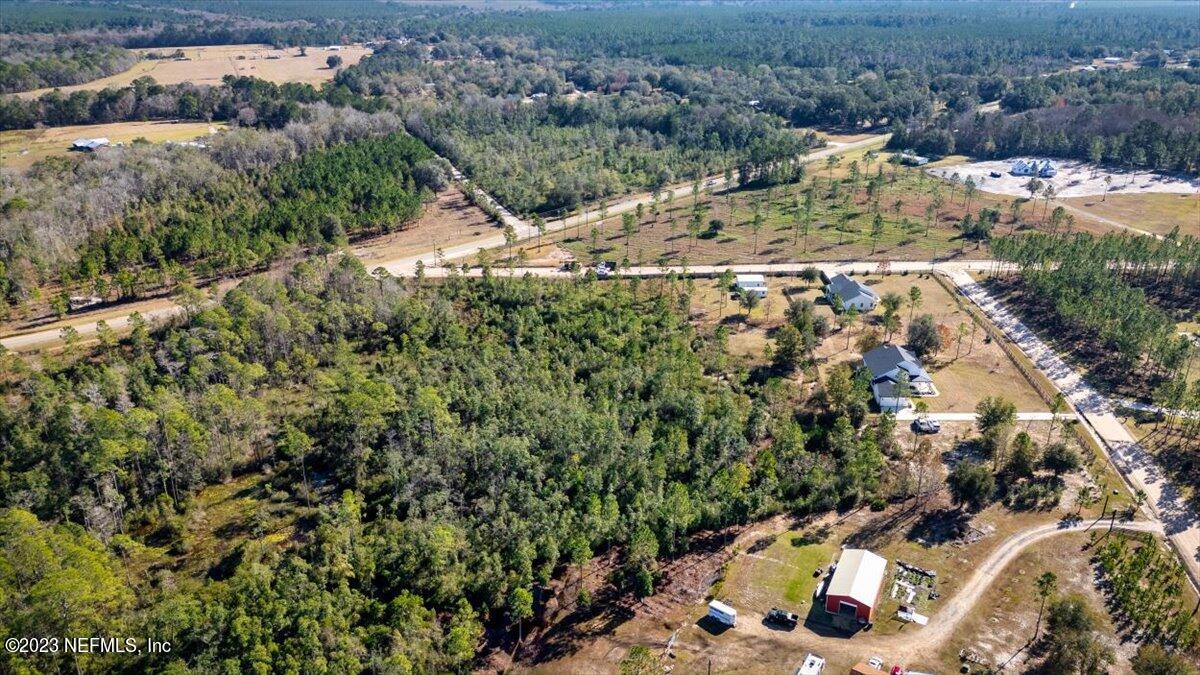 3200 Jane Lane Hilliard, FL 32046 - Photo 71 of 72 an aerial view of a house with a yard