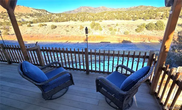 a view of a chairs in back of a balcony