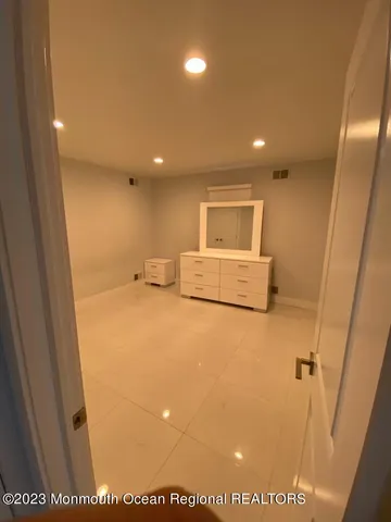 a white toilet sitting next to a bathroom sink