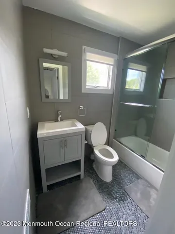 a view of washer and dryer with wooden floor