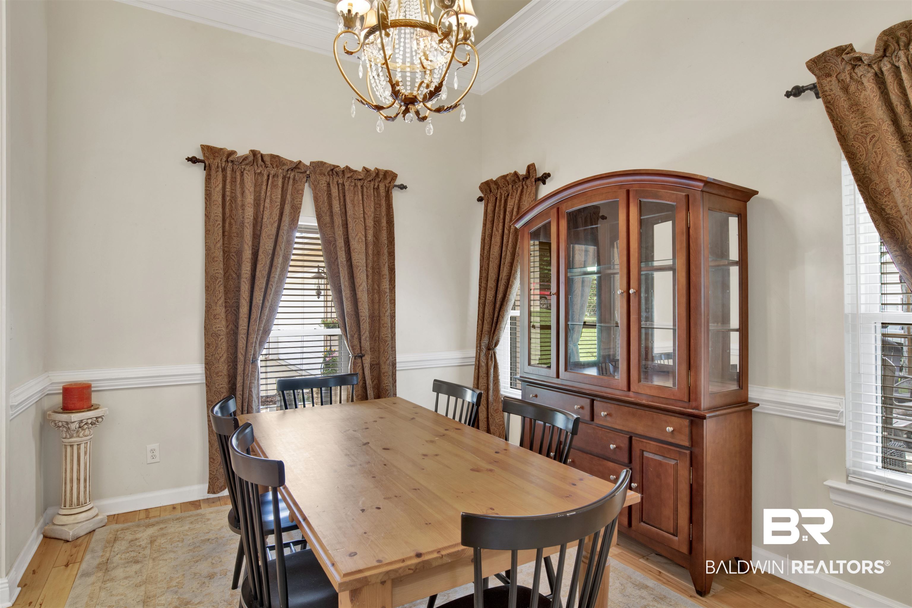 638 Southern Way Daphne, AL 36527 - Photo 11 of 26 Dining area with ornamental molding, light hardwood / wood-style flooring, and a notable chandelier
