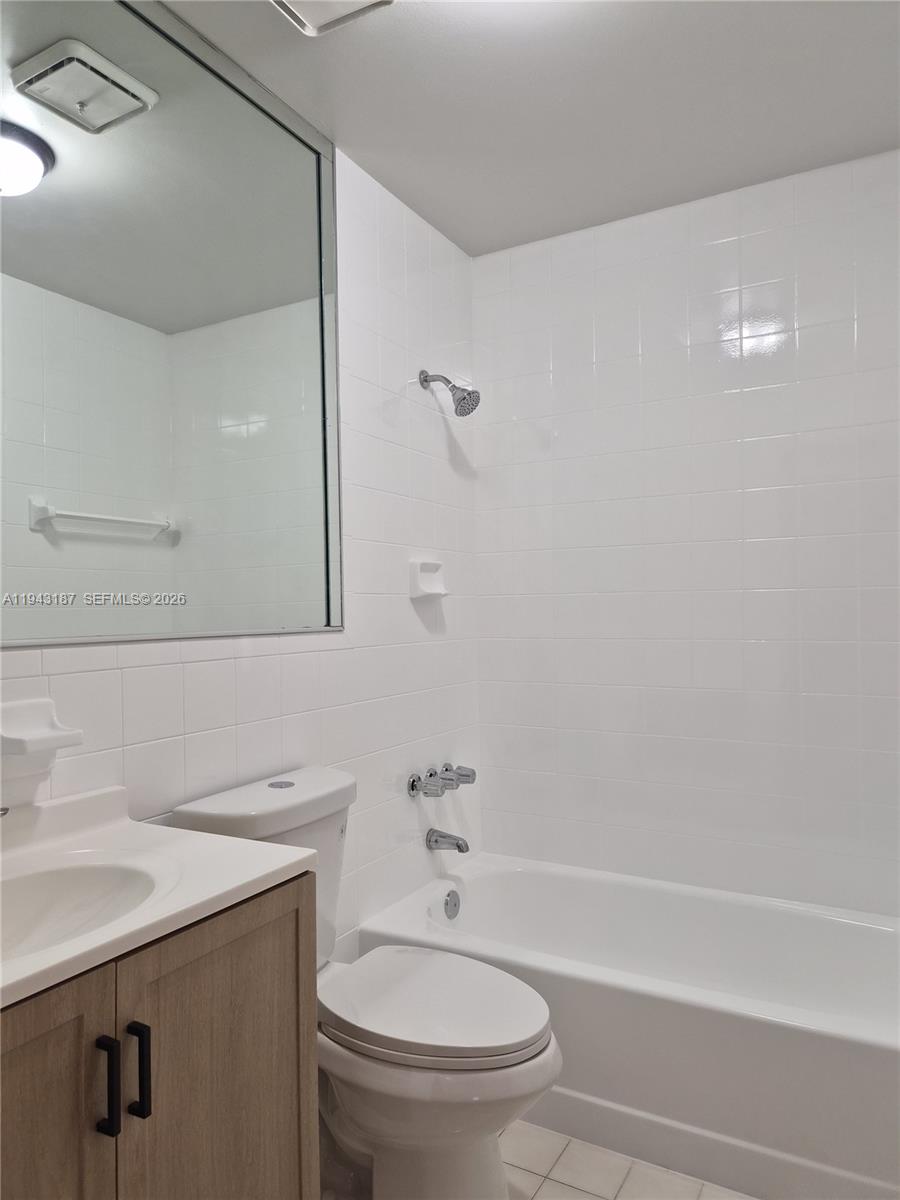 1453 Southwest 137th Place Miami, FL 33184 - Photo 18 of 22 a bathroom with a sink a toilet and shower