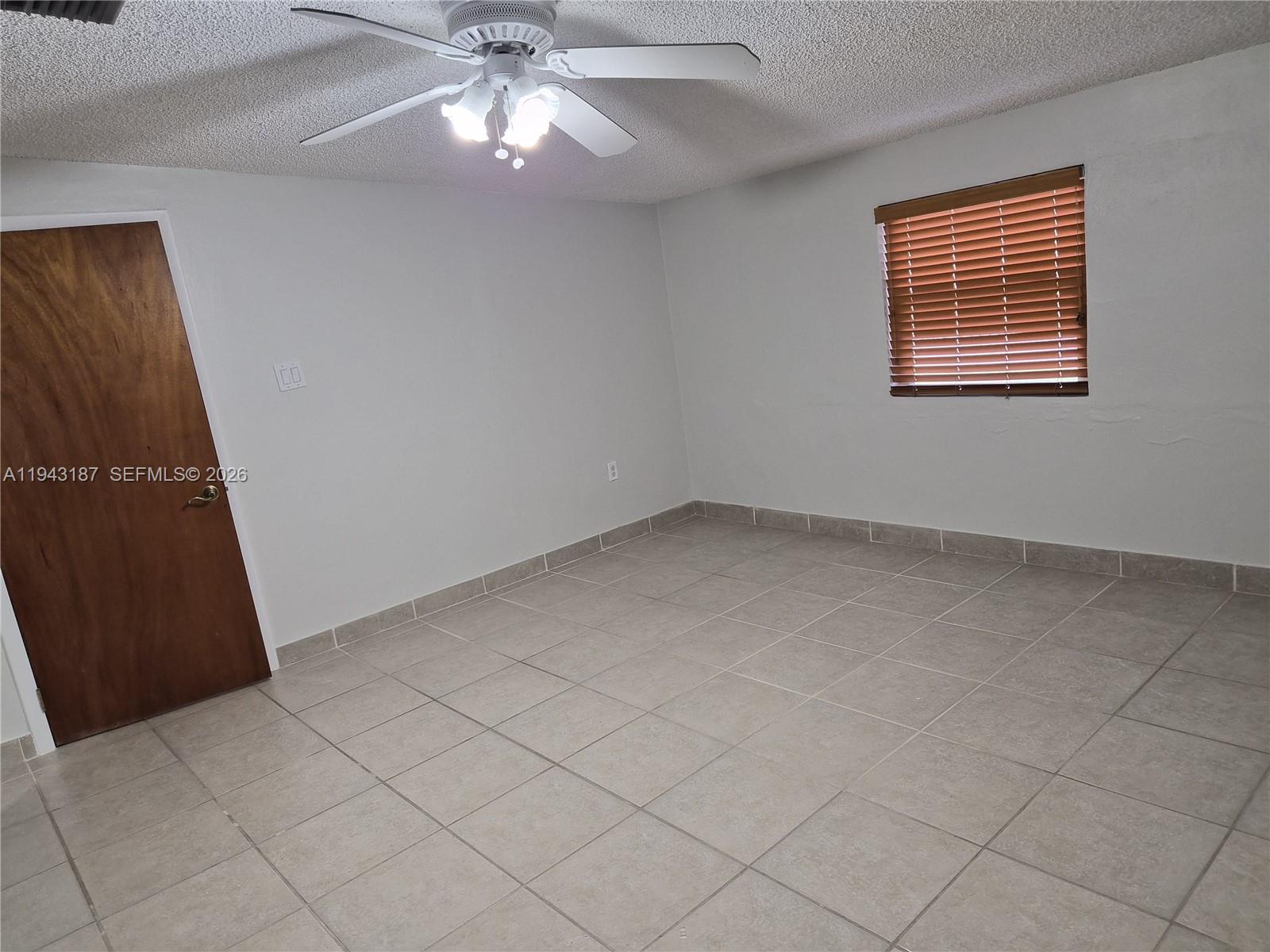 1453 Southwest 137th Place Miami, FL 33184 - Photo 20 of 22 an empty room with a window