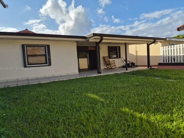 a front view of house with yard and porch