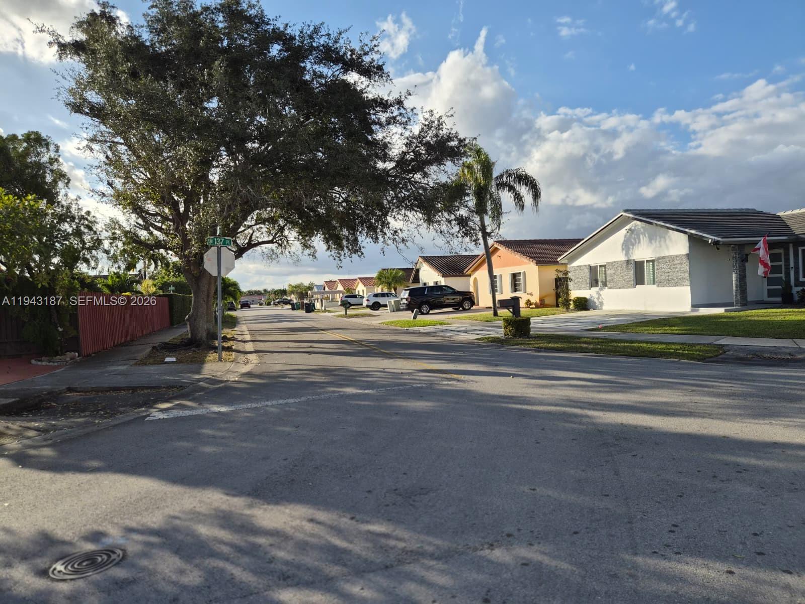 1453 Southwest 137th Place Miami, FL 33184 - Photo 22 of 22 a view of city street with houses
