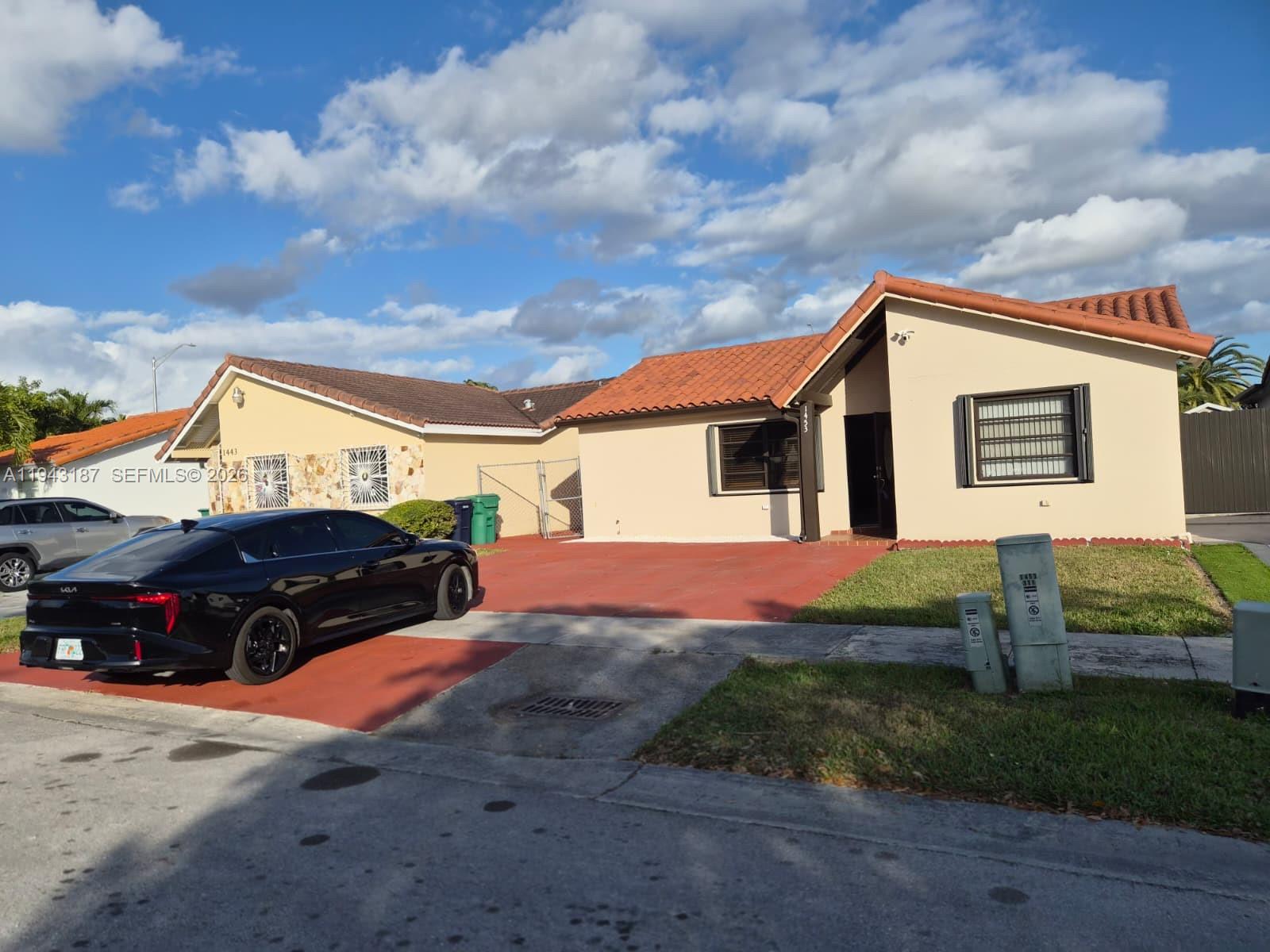 1453 Southwest 137th Place Miami, FL 33184 - Photo 3 of 22 a house view with a garden space