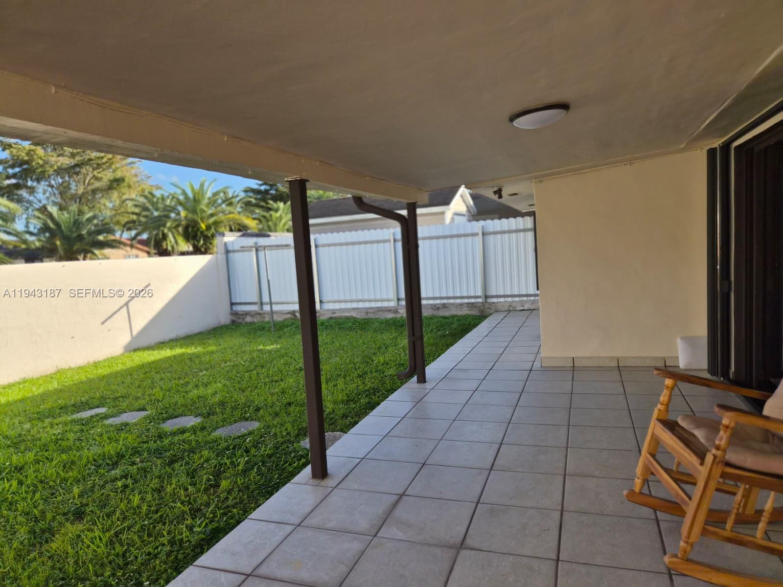 1453 Southwest 137th Place Miami, FL 33184 - Photo 4 of 22 a view of backyard with trampoline