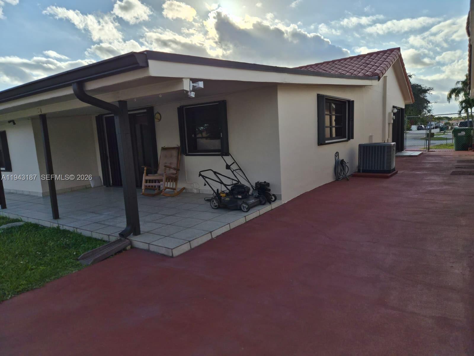 1453 Southwest 137th Place Miami, FL 33184 - Photo 5 of 22 a view of a house with porch