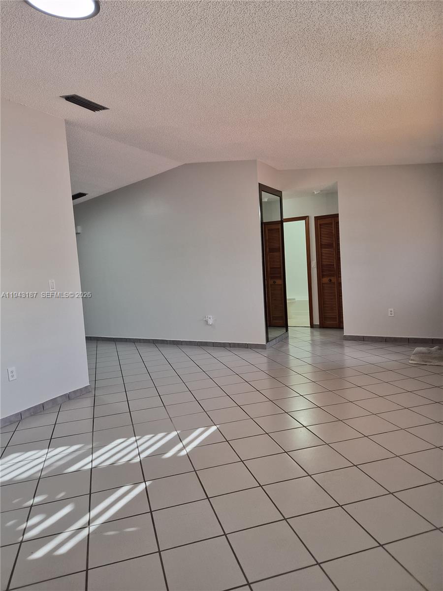 1453 Southwest 137th Place Miami, FL 33184 - Photo 10 of 22 a view of an empty room and window