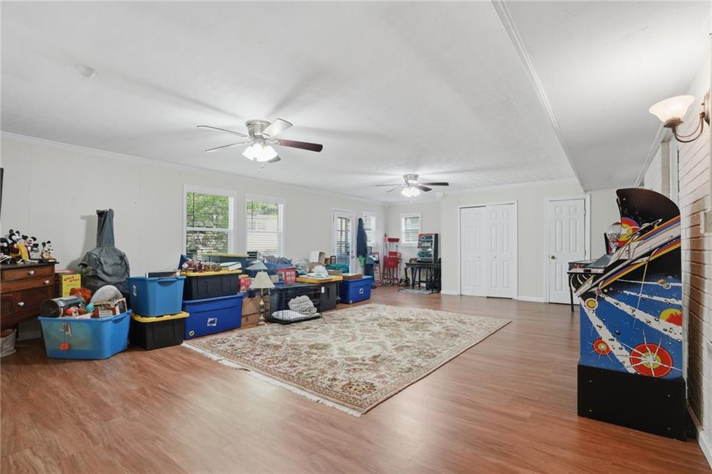5737 Highway 20 Covington, GA 30016 - Photo 5 of 22 a living room with furniture and a flat screen tv