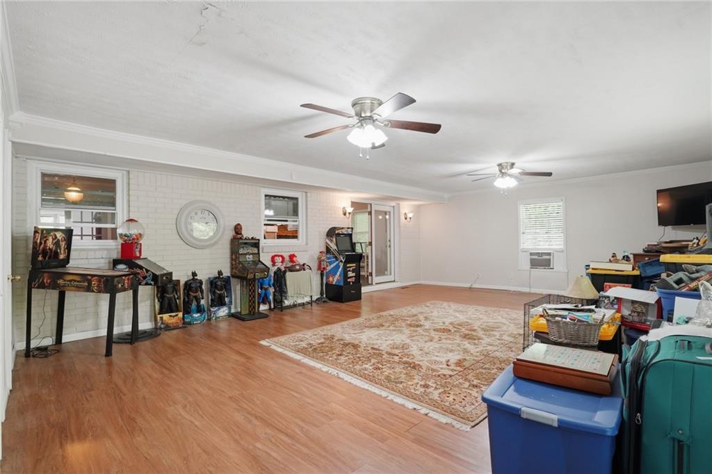 5737 Highway 20 Covington, GA 30016 - Photo 6 of 22 a view of a room with workspace and wooden floor