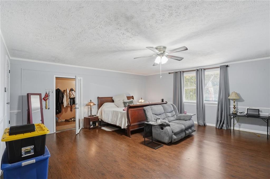 5737 Highway 20 Covington, GA 30016 - Photo 9 of 22 a bed room with furniture and wooden floor