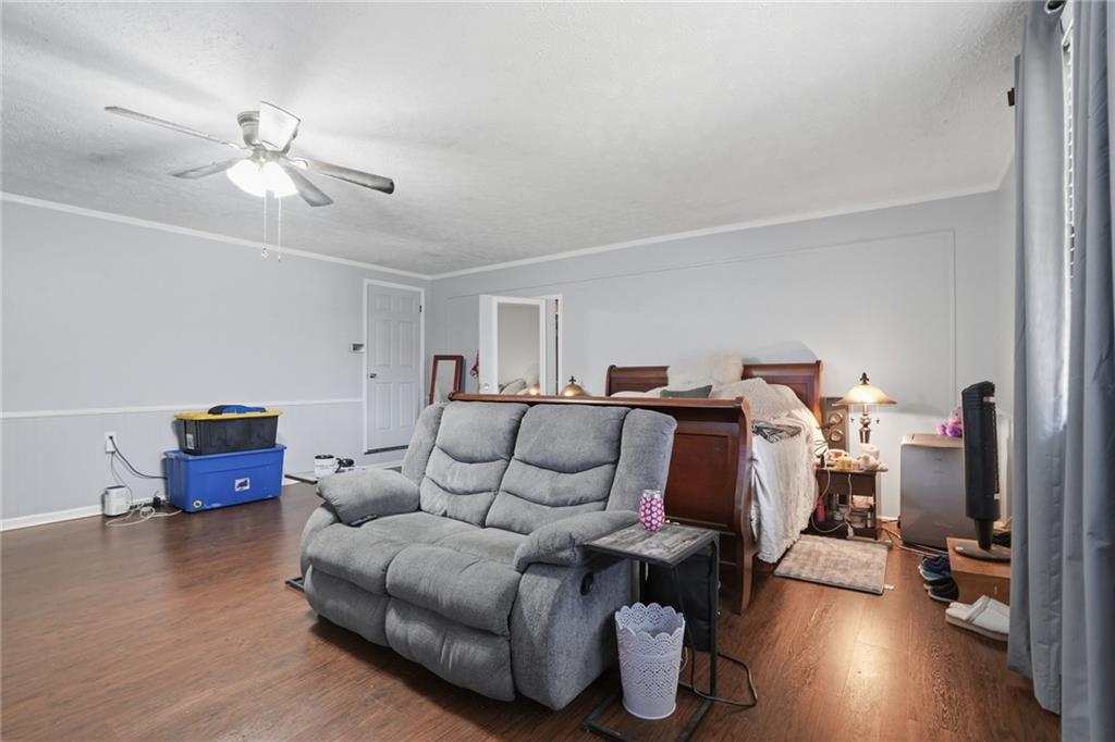 5737 Highway 20 Covington, GA 30016 - Photo 10 of 22 a living room with furniture and a wooden floor