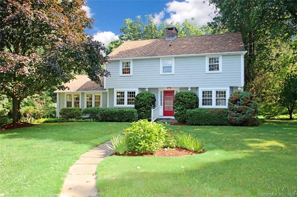 55 Rimmon Road Woodbridge, CT 06525 - Photo 1 of 1 a front view of a house with a yard and green space