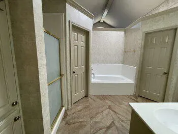 a bathroom with a bathtub and shower