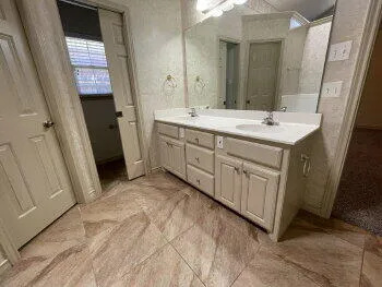a bathroom with a sink and a mirror