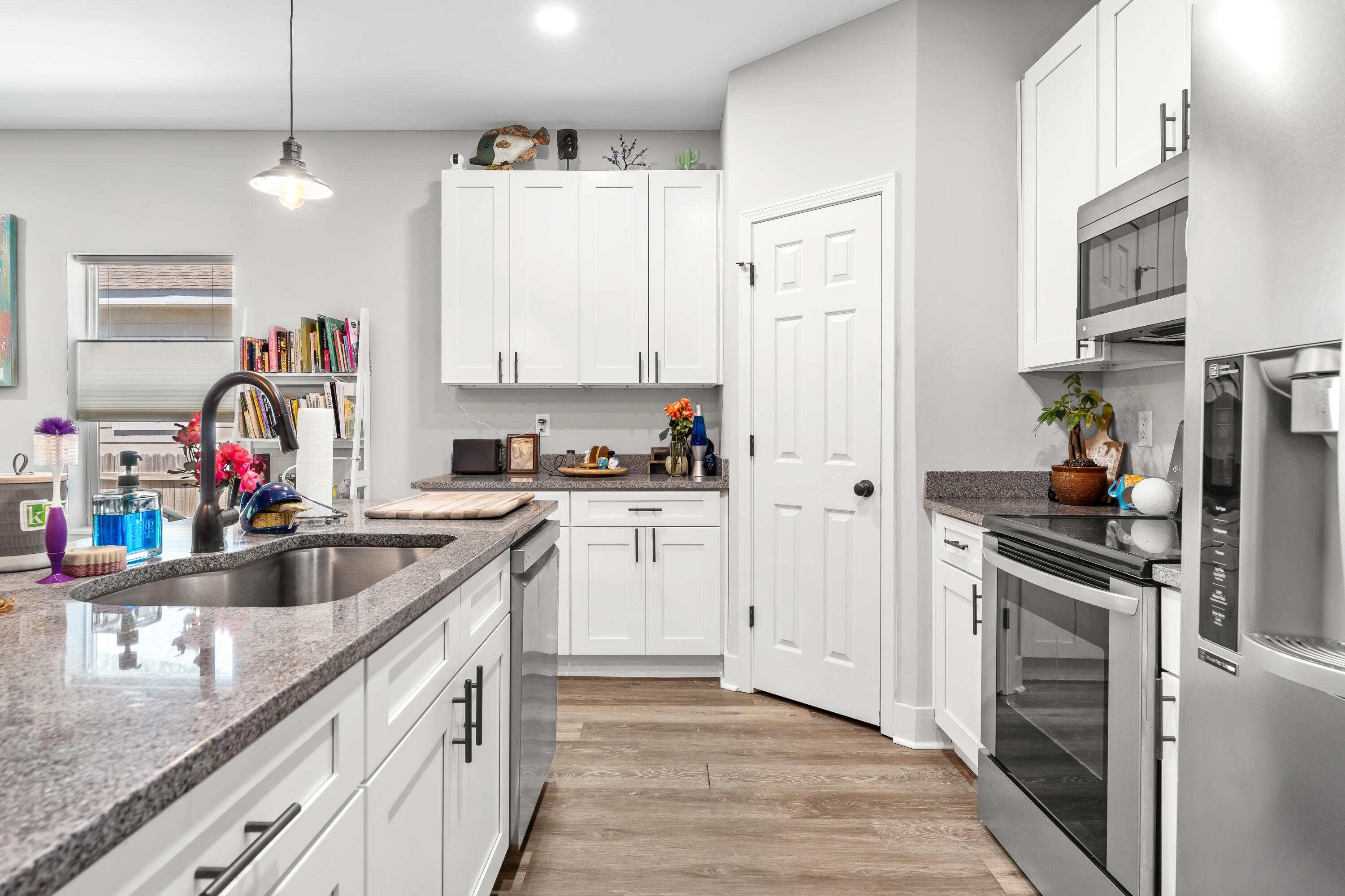 191 Indian Woman Road Santa Rosa Beach, FL 32459 - Photo 14 of 29 a kitchen with white cabinets and appliances