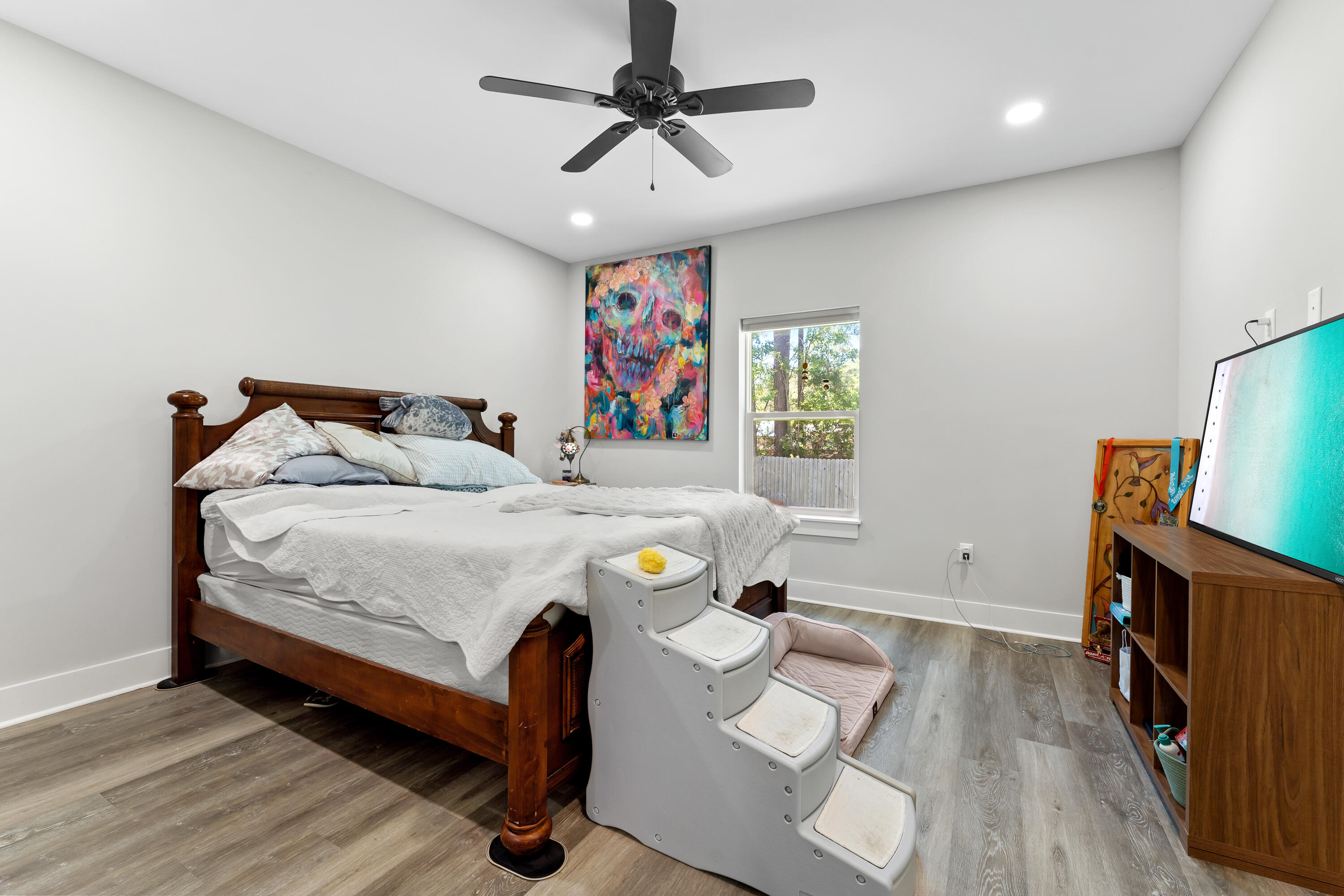 191 Indian Woman Road Santa Rosa Beach, FL 32459 - Photo 18 of 29 a bedroom with a bed and a flat tv screen on dresser