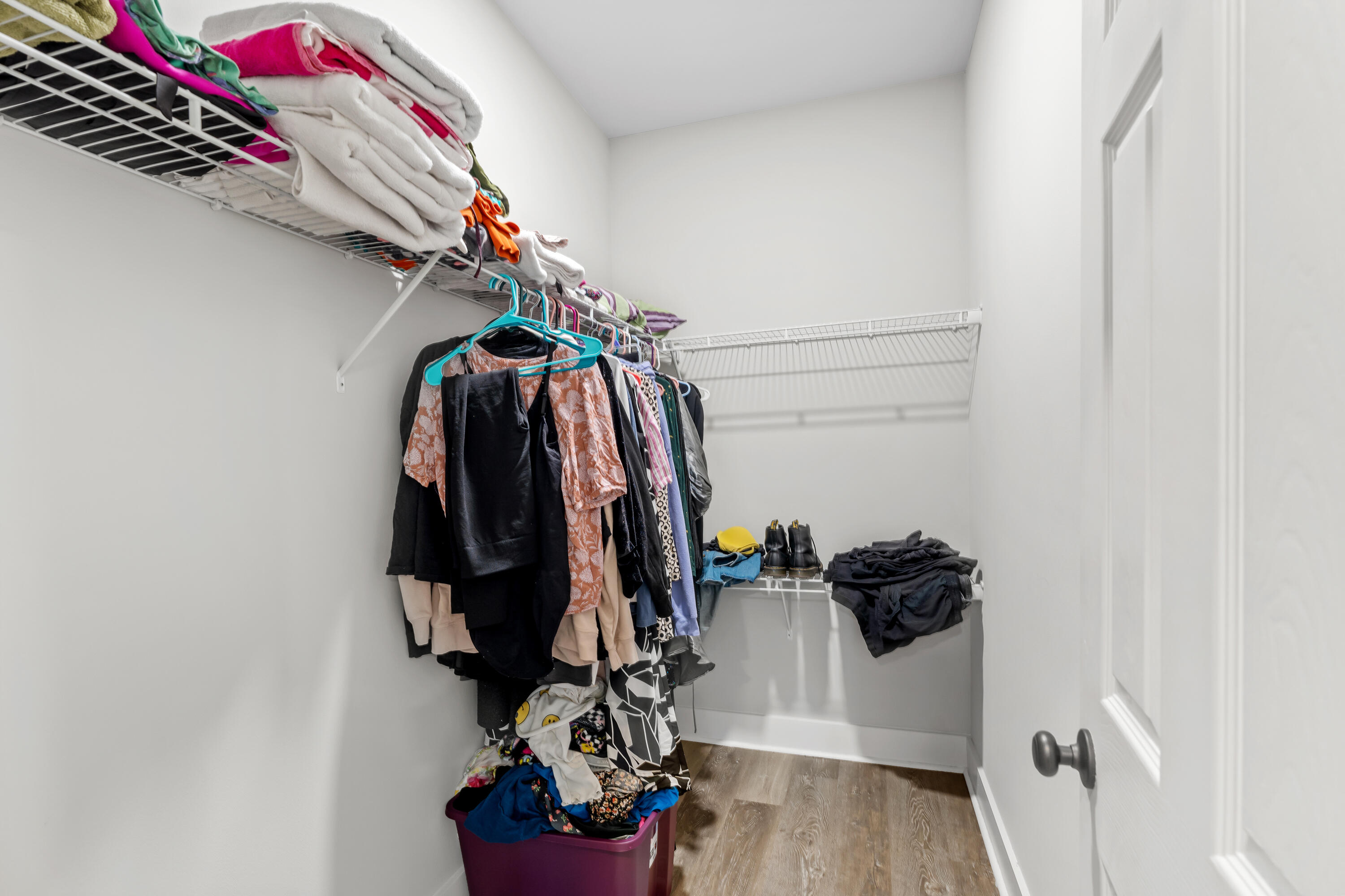 191 Indian Woman Road Santa Rosa Beach, FL 32459 - Photo 19 of 29 a view of walk in closet with clothes and shoes