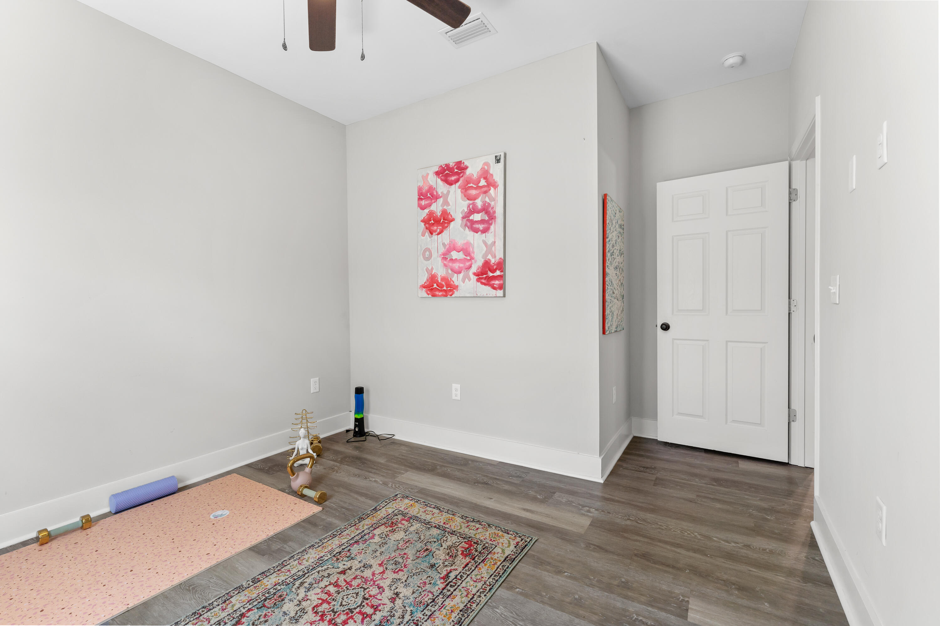 191 Indian Woman Road Santa Rosa Beach, FL 32459 - Photo 23 of 29 a walk in closet with wooden floor