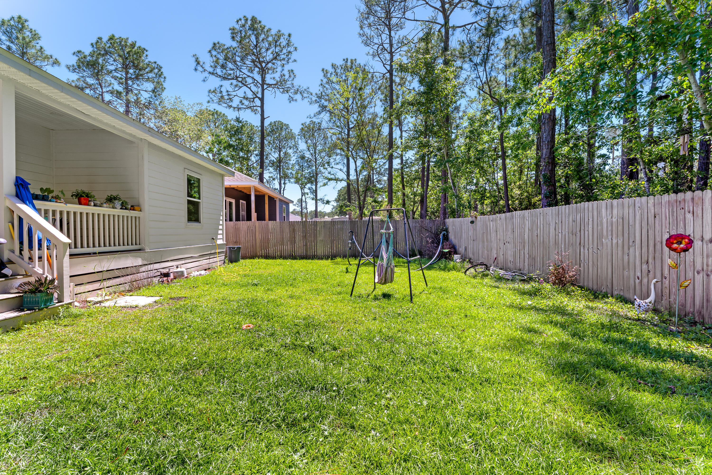 191 Indian Woman Road Santa Rosa Beach, FL 32459 - Photo 27 of 29 a house view with a backyard space