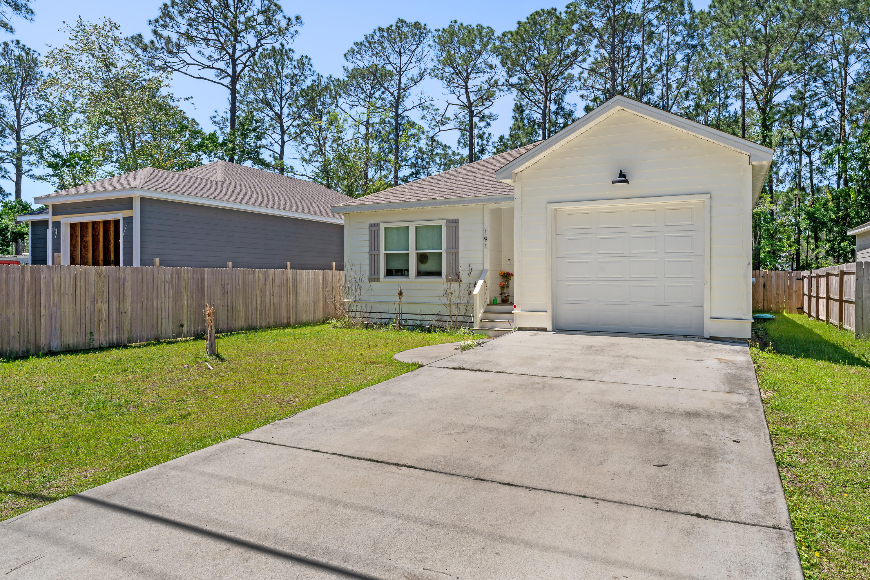 191 Indian Woman Road Santa Rosa Beach, FL 32459 - Photo 3 of 29 a front view of house with yard and green space