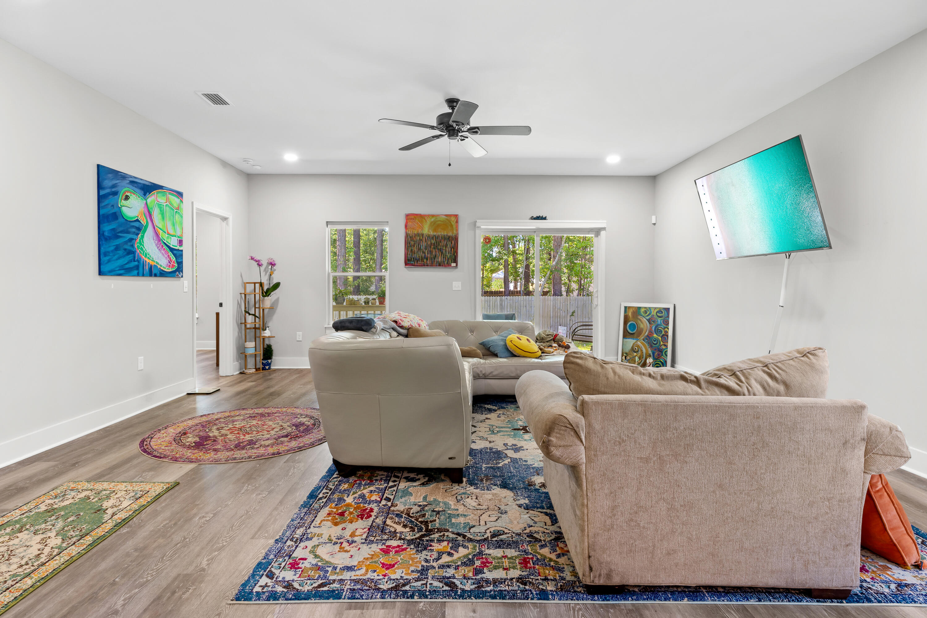 191 Indian Woman Road Santa Rosa Beach, FL 32459 - Photo 8 of 29 a living room with furniture and a flat screen tv
