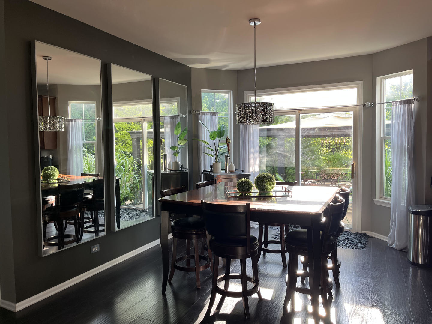 12922 Grande Poplar Circle Plainfield, IL 60585 - Photo 11 of 47 a view of a dining room with furniture window and wooden floor