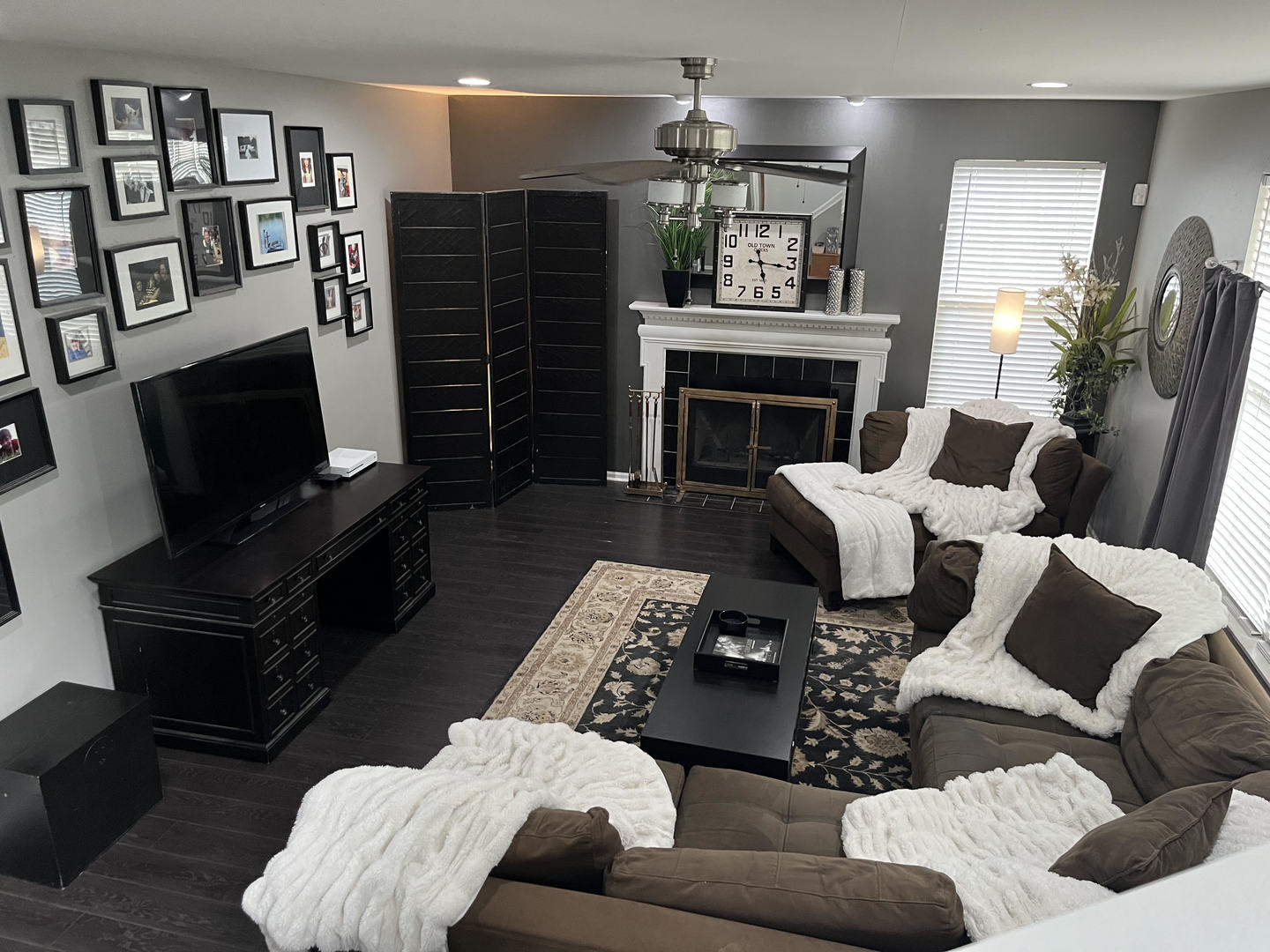 12922 Grande Poplar Circle Plainfield, IL 60585 - Photo 16 of 47 a living room with furniture a flat screen tv and a fireplace