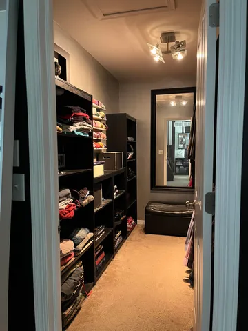 a bathroom with a sink a large mirror and shower