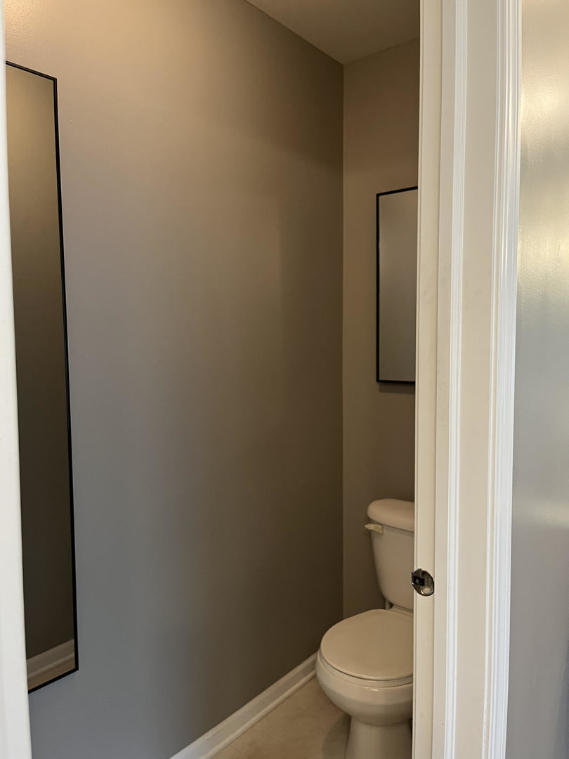 12922 Grande Poplar Circle Plainfield, IL 60585 - Photo 24 of 47 a white toilet sitting next to a shower