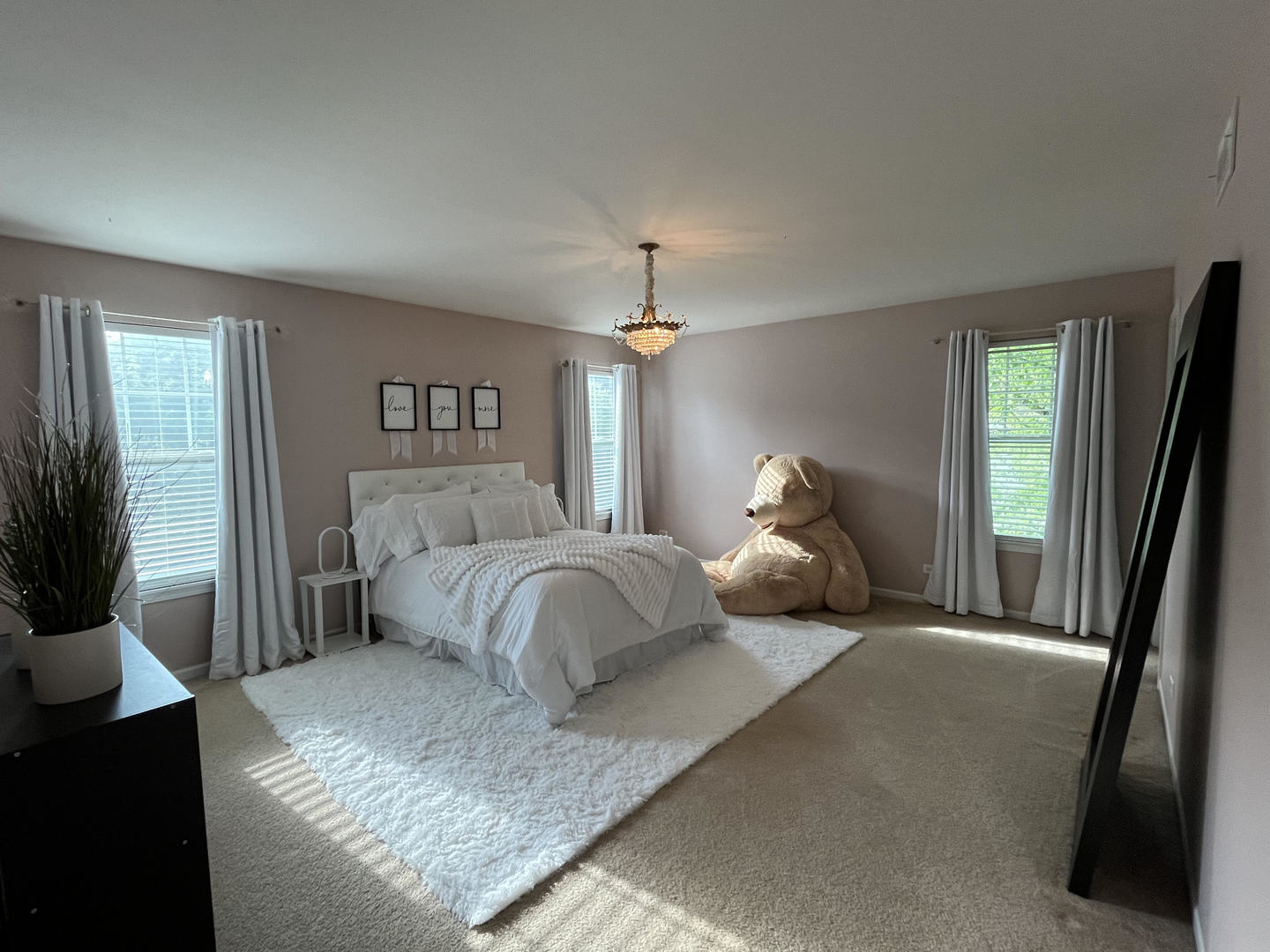 12922 Grande Poplar Circle Plainfield, IL 60585 - Photo 26 of 47 a bedroom with a bed and a chandelier