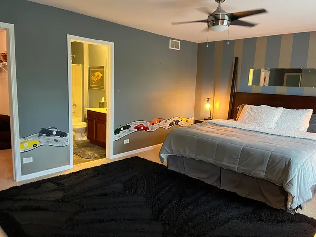 a living room with fireplace furniture and a window