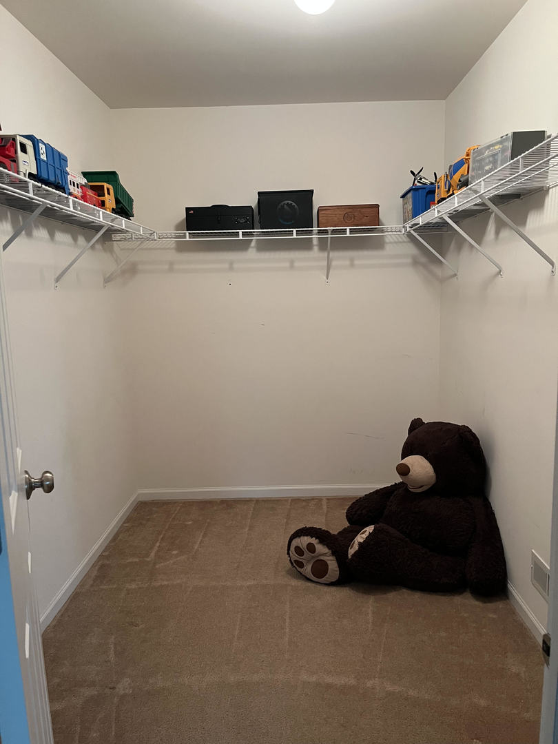 12922 Grande Poplar Circle Plainfield, IL 60585 - Photo 32 of 47 a room with a closet and other equipment