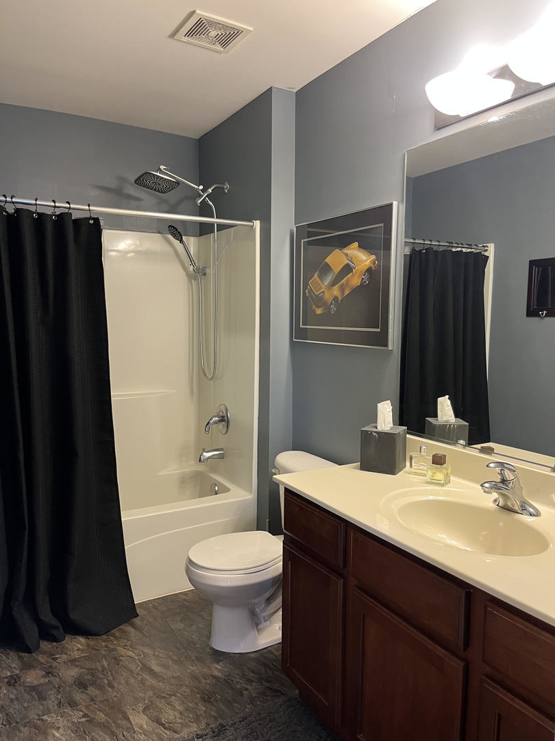 12922 Grande Poplar Circle Plainfield, IL 60585 - Photo 33 of 47 a bathroom with a sink toilet and shower