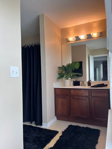 a bathroom with a sink and a window