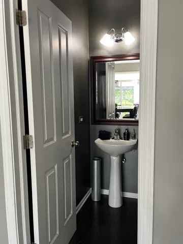 a view of a garage with a bike and a car