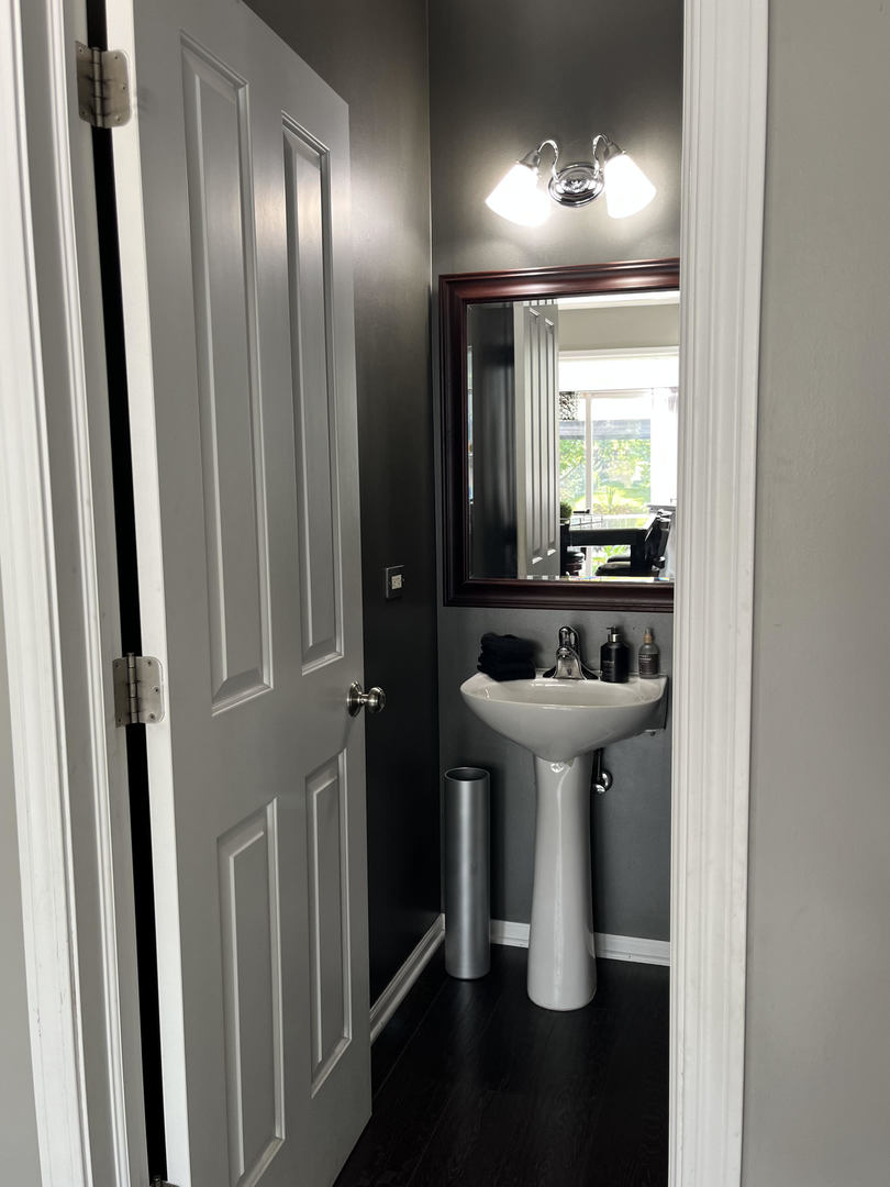 12922 Grande Poplar Circle Plainfield, IL 60585 - Photo 42 of 47 a bathroom with a sink and a mirror