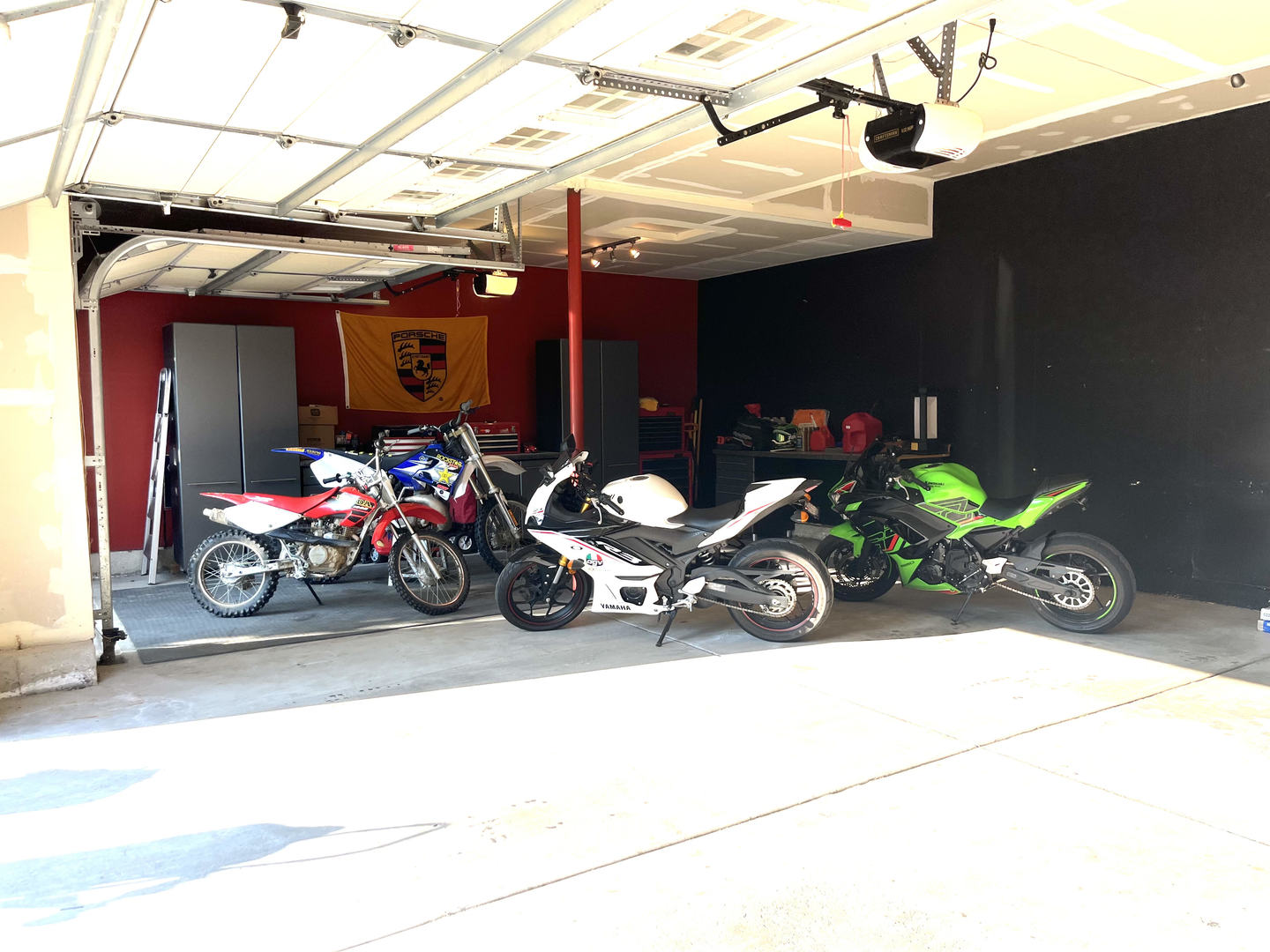 12922 Grande Poplar Circle Plainfield, IL 60585 - Photo 46 of 47 a view of a garage with a bike and a car