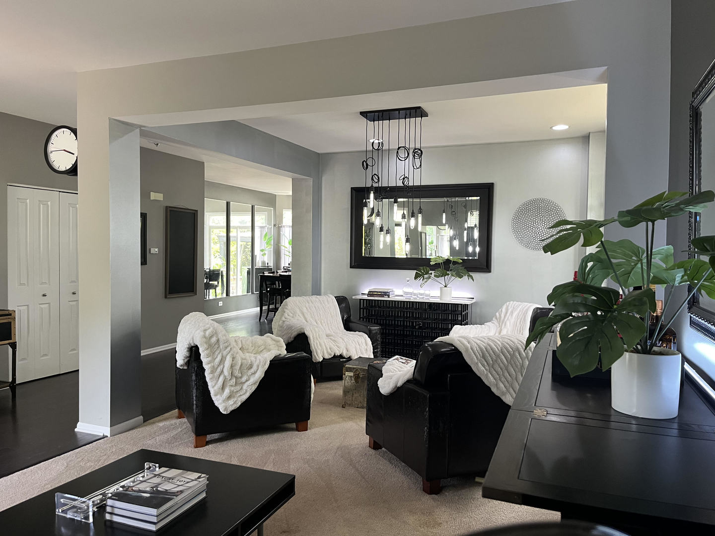 12922 Grande Poplar Circle Plainfield, IL 60585 - Photo 9 of 47 a living room with furniture potted plant and a chandelier